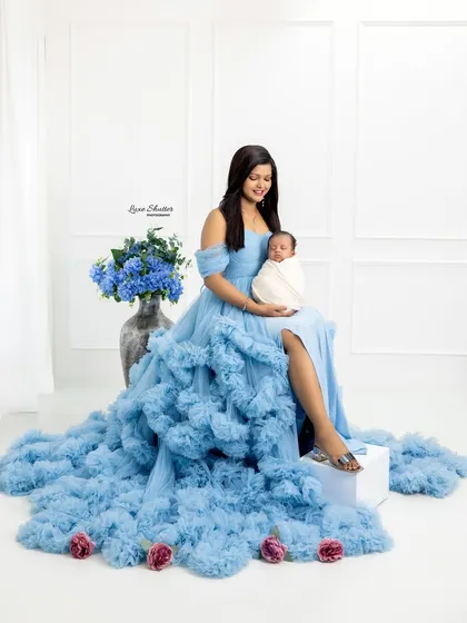 Another angle of the mother and newborn, showcasing the magnificent trail of the gown. These are true fine art portraits.