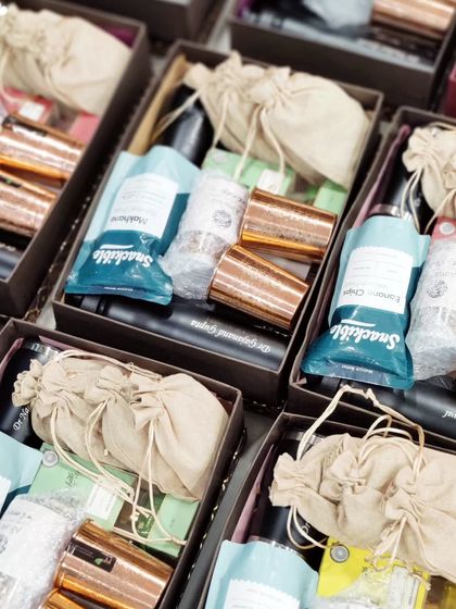 Consistency is key for bulk orders. This image shows multiple hampers packed with an identical set of high-quality items, ready to represent a client's brand.