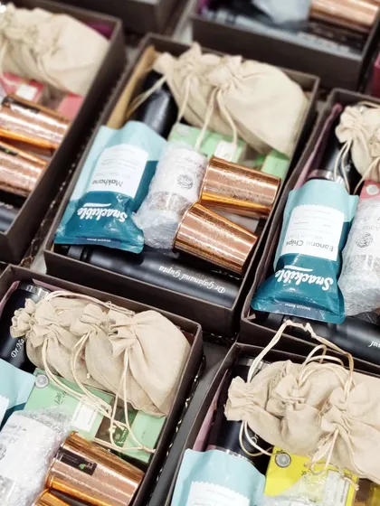 Consistency is key for bulk orders. This image shows multiple hampers packed with an identical set of high-quality items, ready to represent a client's brand.