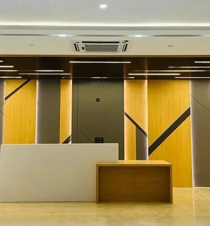 The reception area I designed for St. Xavier's High School makes a powerful first impression. The interplay of geometric wood panels and dynamic strip lighting creates a sense of modern sophistication and institutional pride.