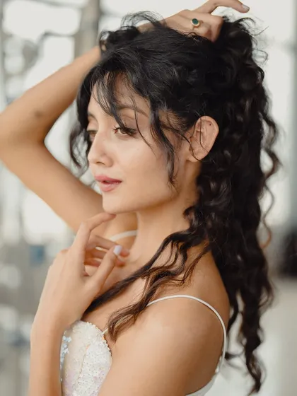 Another angle from the same shoot, showing off the hairstyle. My look is part of my performance and personal expression.