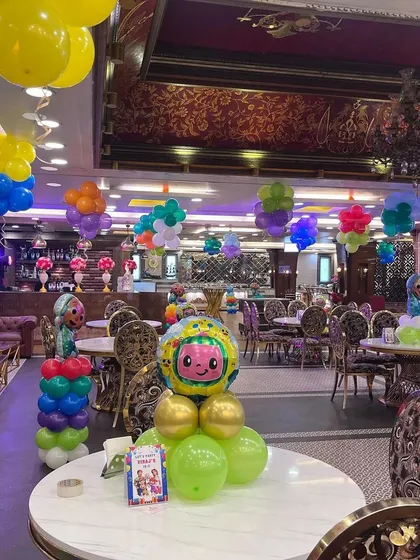 Cocomelon-themed balloon centerpieces I created for each table at a large birthday party.