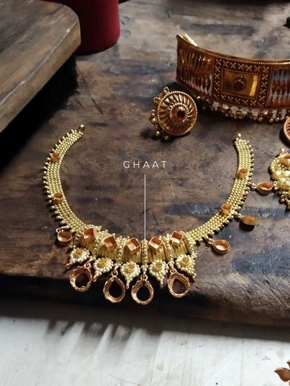 The "Ghaat" or in-making stage of a jewelry transformation. This image shows the raw structure of a necklace being formed from older pieces, a crucial step before polishing and stone setting.