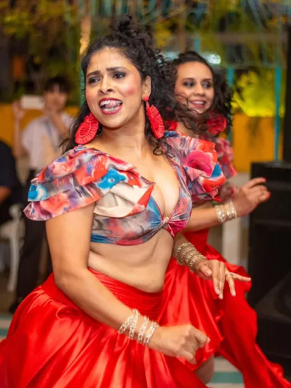 Look at the pure joy on our faces. This is my ladies' team, completely lost in the moment during a live performance. We work hard so we can let go and have this much fun on stage.