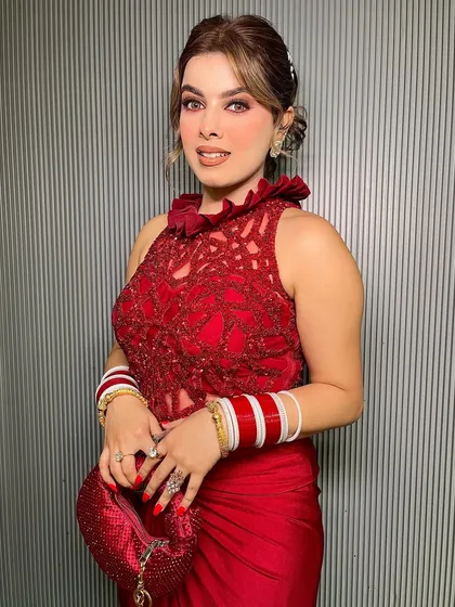 The full view of this elegant red outfit, perfect for a cocktail party or reception.