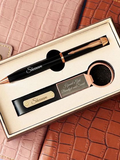 Here, the personalized pen and keychain set is shown inside its premium gift box. This makes for a beautifully presented and easy-to-gift item for birthdays, anniversaries, or corporate events.