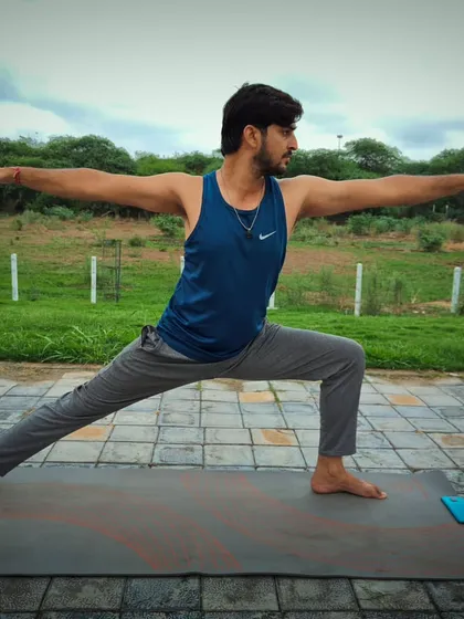 The Virabhadrasana 2, or Warrior Pose, is a fundamental asana for building strength and stability. I teach this to help you strengthen your leg muscles, improve focus, and challenge your body's balance.