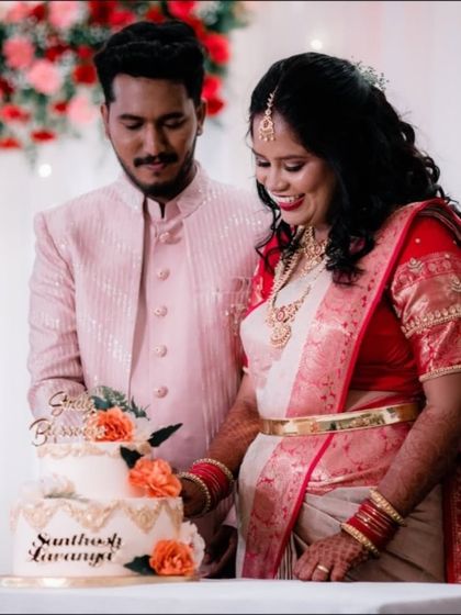 The cake-cutting ceremony, a sweet moment of celebration for the newly married couple.