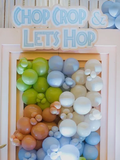 A fun sign 'Chop Chop & Let's Hop' for the Mundan (first haircut) ceremony, tying into the playful, modern jungle theme.