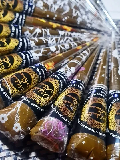 My fresh, handmade organic henna cones are ready to go. Each cone is packed with my signature paste, made from all-natural ingredients with no added chemicals, ensuring a safe application and a beautiful, dark stain.