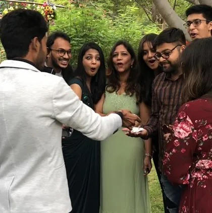 The magic is happening right in their hands. This kind of close-up illusion, performed for a small group at a wedding, makes the experience incredibly personal and impactful.