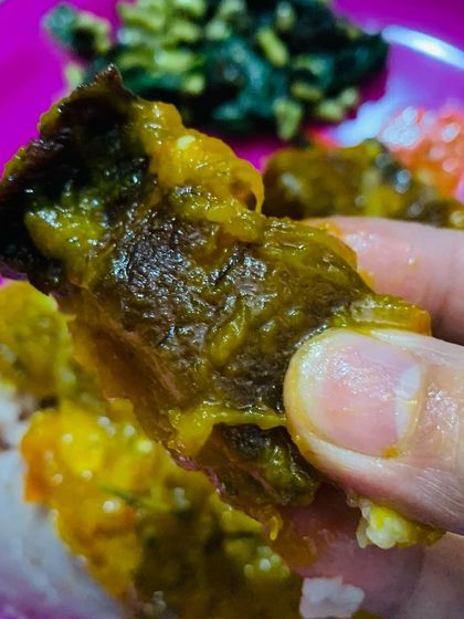 A piece of the delicious smoked pork with pumpkin curry, served with rice.