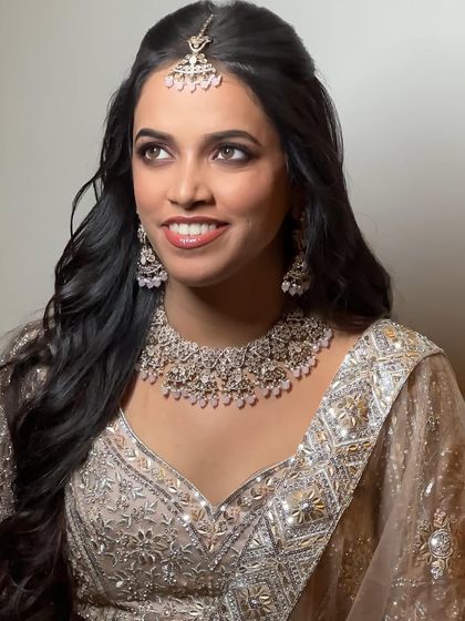 A beautiful portrait of the bride-to-be. The makeup is designed to make her feel confident and beautiful for her ring ceremony.