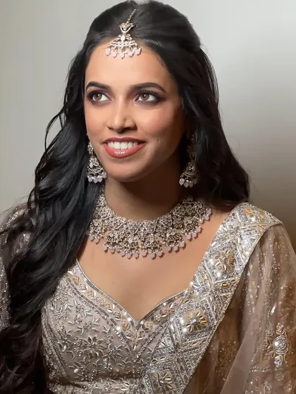 A beautiful portrait of the bride-to-be. The makeup is designed to make her feel confident and beautiful for her ring ceremony.