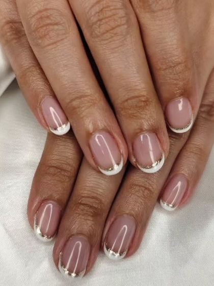 A beautiful French overlay with a twist. The classic look is updated with a thin silver chrome line along the French tip.