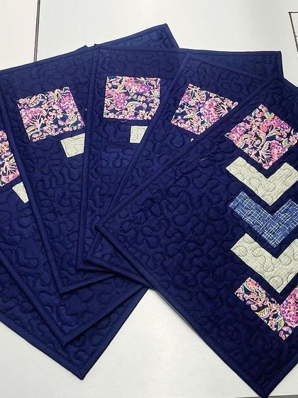 A fanned-out view of the geometric placemats.