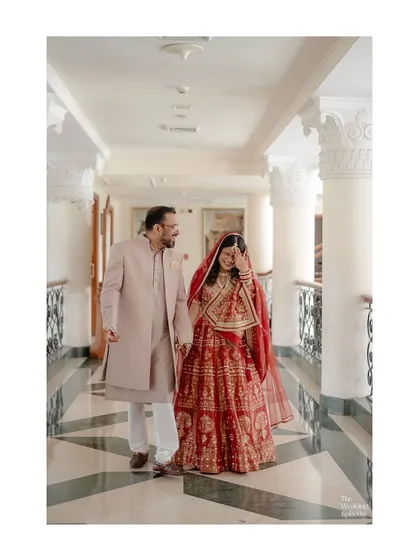 A candid moment of the bride laughing while walking with her groom. It's these unposed, genuine reactions that we strive to capture.