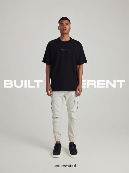 A full-look shot for streetwear brand Understated. The campaign's minimalist and clean aesthetic was achieved using our white cyclorama, ensuring the focus remains on the apparel and branding.