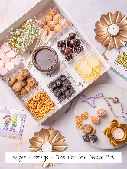 Our 'Sugar & Strings' Chocolate Fondue Box, specially curated for Rakhi. It's a box full of indulgence, designed to melt hearts and create sweet memories.