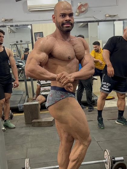 One man army. A side chest pose, one of the classic bodybuilding poses to showcase overall upper body mass.