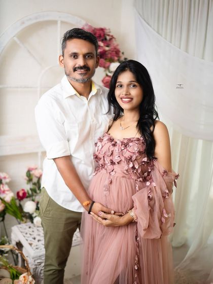A classic portrait of the expecting couple. Their direct, happy smiles towards the camera make this a timeless keepsake of their journey to becoming parents again.