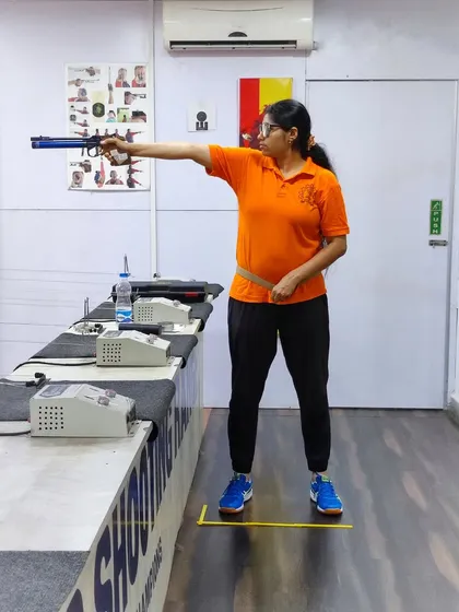 Can you spot what needs correction? I often ask my students to analyze each other's posture. Here, a pistol shooter demonstrates her stance.