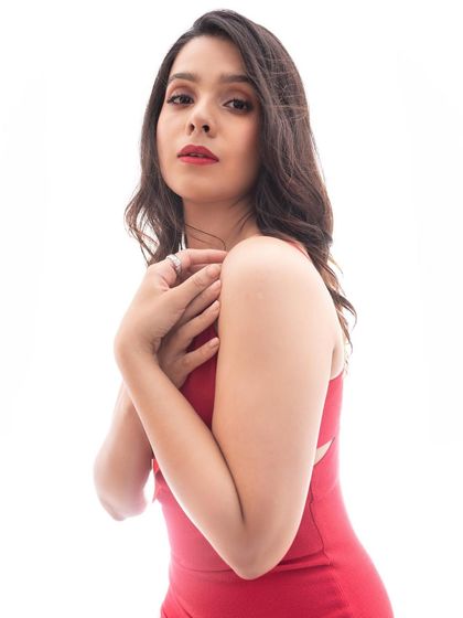 Another angle of the red-carpet look, showing how the makeup enhances her features and creates a beautiful, polished appearance.