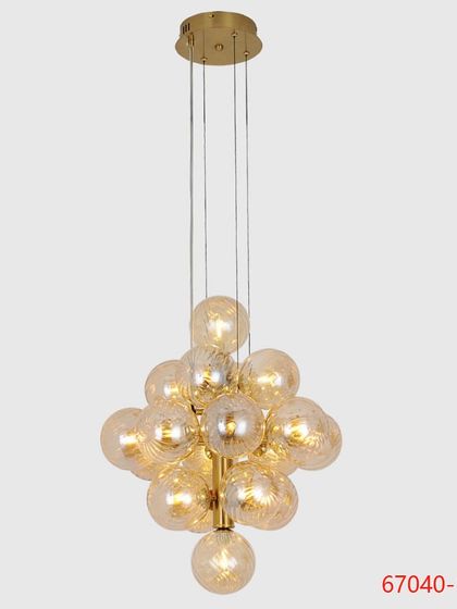 A cluster chandelier with amber-tinted glass globes, perfect for creating a warm and inviting atmosphere over a staircase or in a cozy nook.