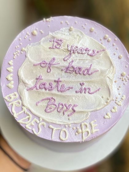 A bento cake for a bride-to-be with a sense of humour. This chocolate truffle cake reads "13 years of bad taste in Boys" and is perfect for a bachelorette party.