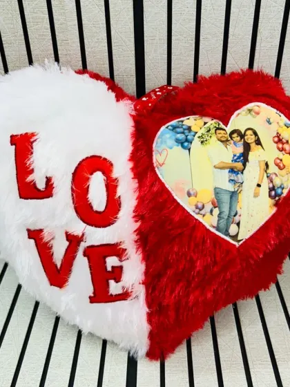 A soft and cuddly way to show your love. This heart-shaped cushion can be personalized with your favorite photo, making it a sweet gift for Valentine's Day or an anniversary.