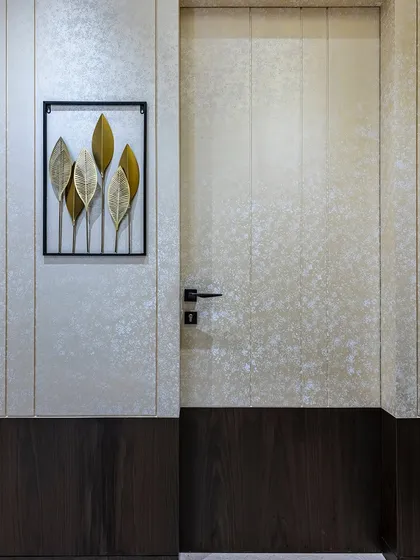 The passage and door design of this Mumbai home redefines sophistication. With seamless detailing and a focus on aesthetics, the space connects rooms while adding a sense of grandeur and harmonious flow.
