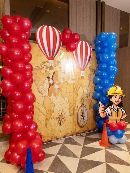 The 'air' travel section featured this beautiful hot air balloon backdrop against a vintage world map. The red and blue balloon columns added a pop of color.