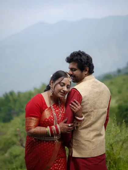 Finding solace in each other's arms. This candid couple portrait captures a moment of quiet intimacy amidst the beautiful natural scenery of a mountain destination.