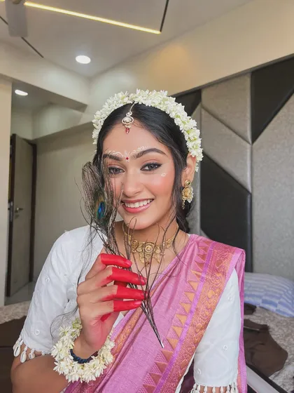 Another beautiful angle of the Radha look, showcasing the winged eyeliner and the delicate bindi art.