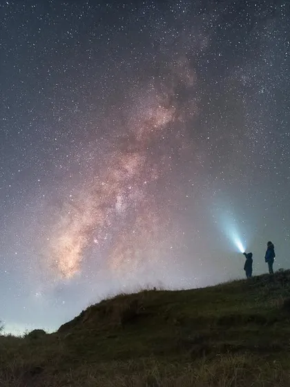 To give a sense of scale to the cosmos, I framed two fellow adventurers against the magnificent Milky Way in Singalila National Park. This image isn't just about the stars; it's about the human experience of wonder when faced with the vastness of the universe. It’s a core part of my astrophotography workshops.