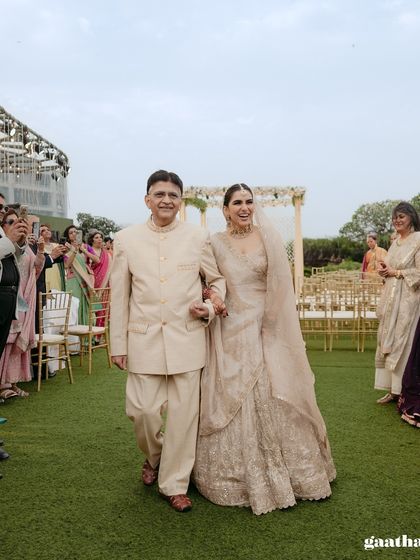 The bride walking down the aisle with her father, a cherished and emotional moment in any wedding.