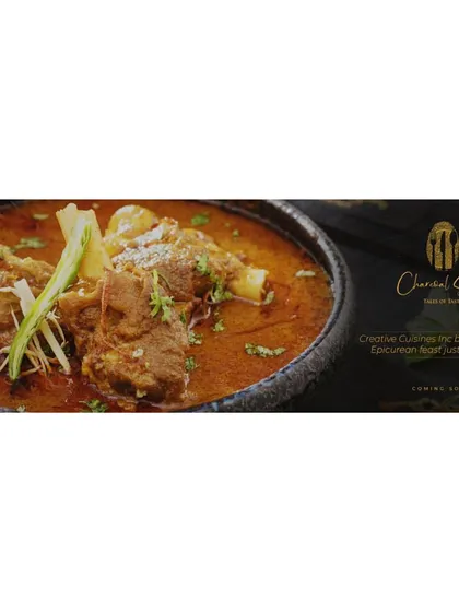 A promotional image for 'The Charcoal Story', showcasing our expertly prepared North Indian cuisine. This dish is an example of the epicurean feast we are bringing to homes, combining traditional recipes with our signature quality.