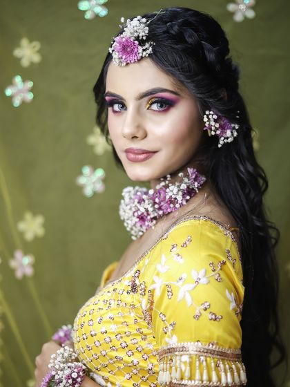 A smiling portrait of the model, capturing the joyful spirit of a pre-wedding ceremony.