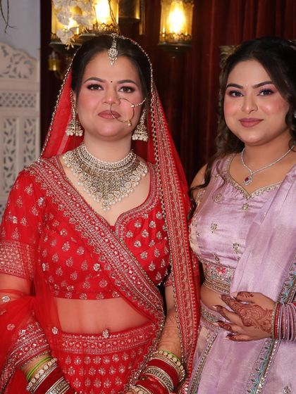 A lovely photo of the bride with her sister. I create soft, radiant looks for the entire bridal party to ensure everyone looks and feels their best.
