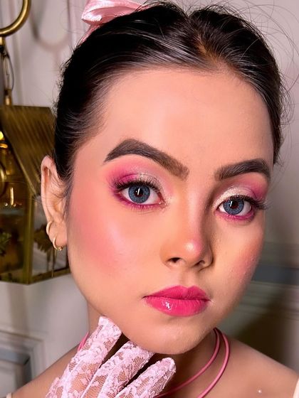 A full face view of the Barbie makeup, complete with colored contact lenses to enhance the doll like effect. This shows how accessories can be used to complete a creative vision.