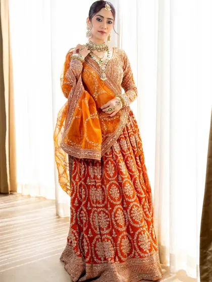 For the bride who wants to look nothing less than royal. This burnt orange lehenga with its rich embroidery and sequin work is a true masterpiece. We make sure every detail is perfect, so you can shine on your wedding day.
