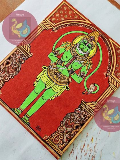 The completed Hanuman painting, shown at an angle. The rich colors and textures are visible here.