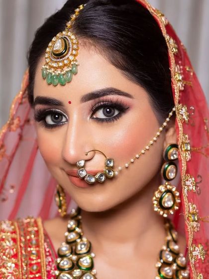 A close-up of this bride's stunning eyes. The makeup is bold yet classic, with a sharp winged liner and defined lower lash line that makes her eyes the centerpiece of the look.