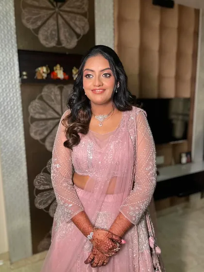 The complete look, with soft waves and a radiant complexion, perfect for celebrating a special milestone.