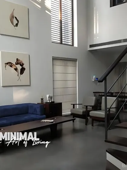 We believe minimalism is an art form. This double-height living room uses clean lines, natural light, and a curated selection of furniture to create a space that feels both grand and calming.