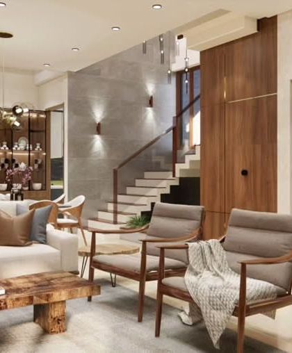 Another angle of the Odion Woods living area, showing the comfortable seating arrangement and the material contrast between the wood paneling and the tile-clad wall.