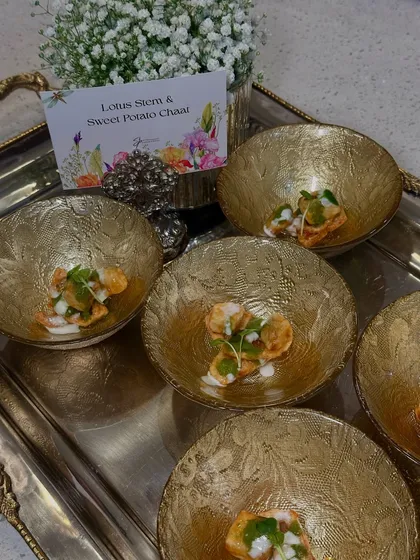 Lotus Stem & Sweet Potato Chaat, a modern take on a traditional street food, served in ornate golden bowls.