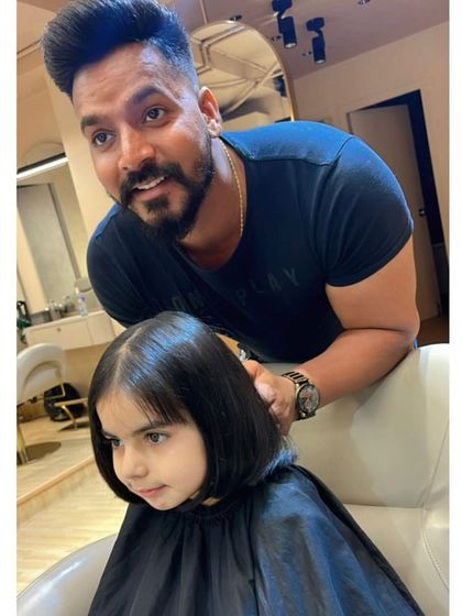 Our stylist giving a cute bob haircut to one of our youngest clients. We make sure the experience is fun and comfortable for everyone.