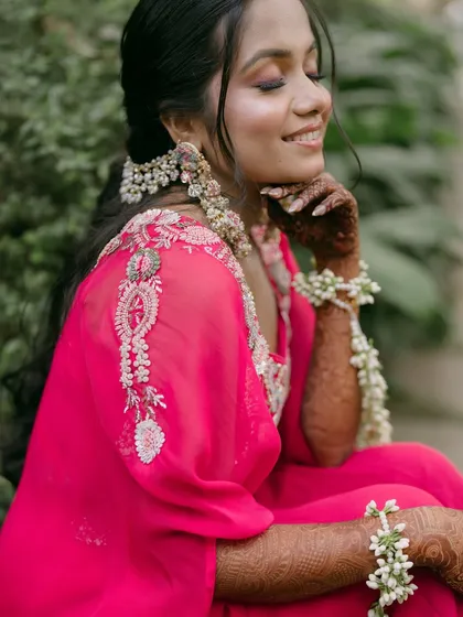 A serene and happy portrait of the bride, her face glowing with joy and beautiful makeup.