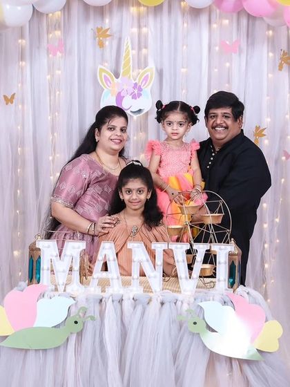 A magical 'Frozen' themed birthday party, transforming the venue into a winter wonderland with icy blue and white decor, character cutouts, and shimmering backdrops.